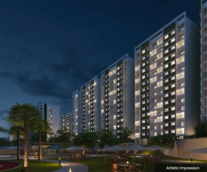Adarsh Parkland Phase 2 apartment towers illuminated at night, Panathur Main Road, East Bangalore